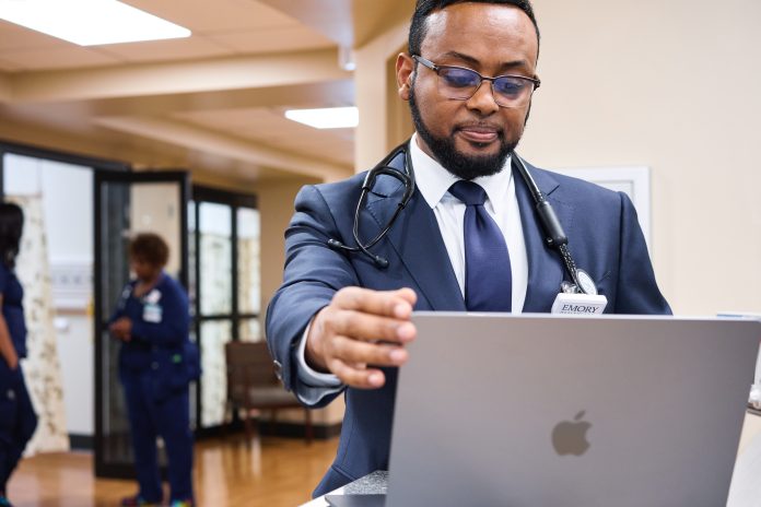 Apple-Emory-Hillandale-Hospital-Dr-Tekleyes-with-MacBook-Air Apple Emory Healthcare