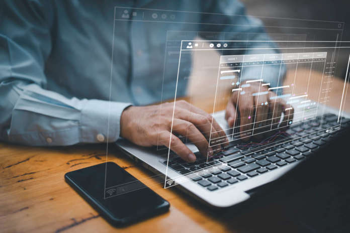 Analyst working with computer in Business Analytics and Data Management System to make report with KPI and metrics connected to database. Corporate strategy for finance, operations, sales, marketing