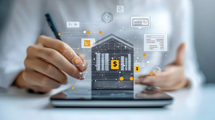 Simbolo di banca sopra un tablet con utente che interagisce usando una penna ottica