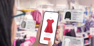 Utilizzo di private AI nel retail: Negozio di abbigliamento tramite un'app per smartphone con palloncini intorno che suggeriscono consigli sull'abbigliamento
