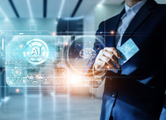 AI nei processi amministrativi: come cambia la riconciliazione bancaria nelle imprese Uomo d'affari in un ambiente futuristico utilizza un'interfaccia olografica di AI Banking con una carta, simboleggiando l'innovazione nei servizi finanziari e la riconciliazione bancaria automatizzata