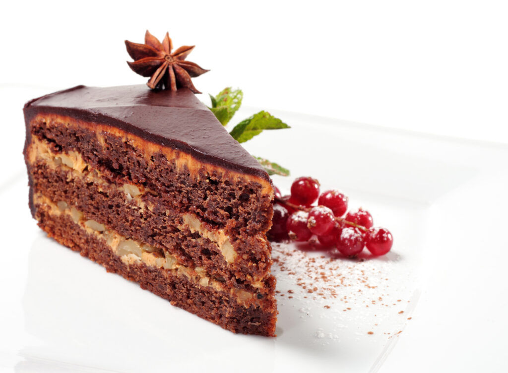 Chocolate Iced Pie with Anise, Fresh Berries and Mint. Isolated on White Background