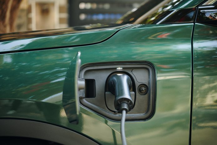 Plug Inserted in Electric Car Pnrr: rideterminate le risorse per l'ambiente