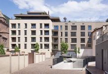 Un edificio compatto che dialoga con il paesaggio circostante