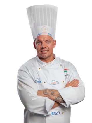 &Aacute;d&aacute;m Fazekas of the Fazekas Cukr&aacute;szda igelateria in Budapest with the flavor Pistachio Fruit