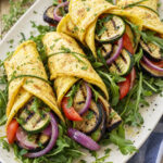 Omelette ratatouille con rucola ed erbe