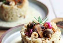 Risotto funghi e noccioli su fonduta di parmigiano