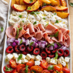 Antipasto di pesche, burrata, ciliegie e pomodorini
