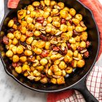 Gnocchi con pomodorini confit e mandorle