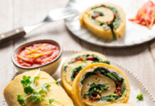 Rollè di farinata con crema di anacardi, erbette e pomodori