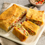 Terrina di crespelle alle lenticchie rosse con ortaggi estivi