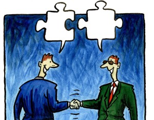 Two businessmen shaking hands and talking