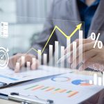Businessman analyzing profit and quality management concepts long term cost planning, product quality, budgeting, financial forecasting, and company revenue and expense projections.