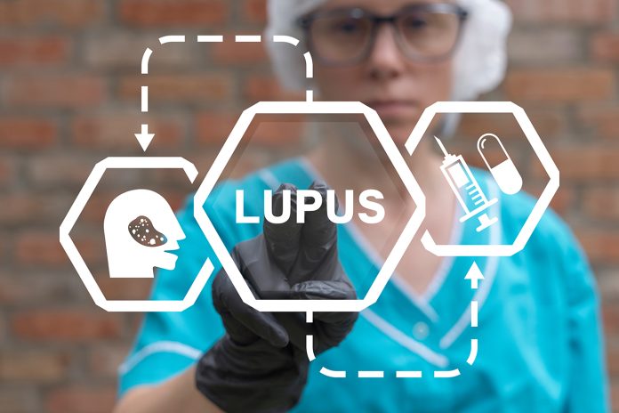 Doctor using virtual touch screen presses word: LUPUS. Lupus dis