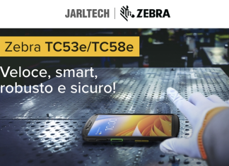 Zebra TC53e/TC58e: veloce, smart, robusto e sicuro Mobile computer Zebra TC53e/TC58e su superficie industriale metallica, con guanto da lavoro in primo piano; slogan “Veloce, smart, robusto e sicuro!” e loghi Jarltech e Zebra in alto.
