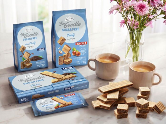 • Confezioni di wafer Lago Group Be-Goodie Sugar Free in vari formati esposte a Tutto-food 2026 con tazze di caffè su un tavolo