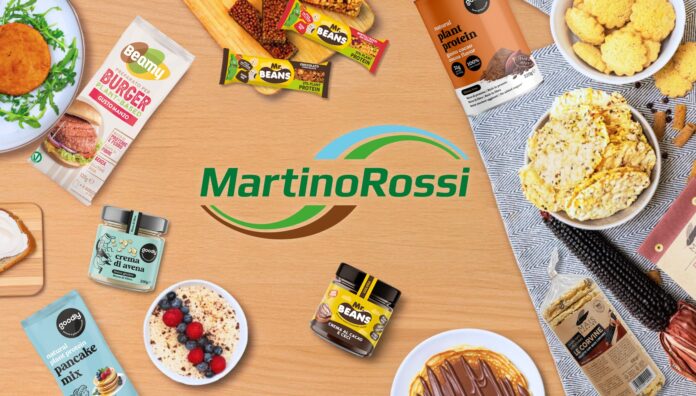 Gamma prodotti MartinoRossi a Tuttofood 2026: innovazioni plant-based e proteiche dei brand Beamy, Mr.Beans e Goodly in mostra su sfondo legno