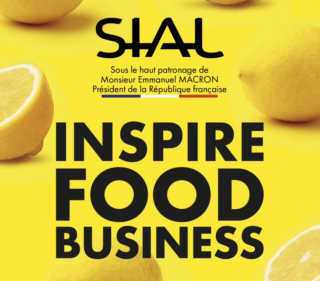 Logo Sial 2026 su sfondo giallo con limoni, claim "Inspire Food Business" e alto patrocinio del Presidente della Repubblica Francese Emmanuel Macron