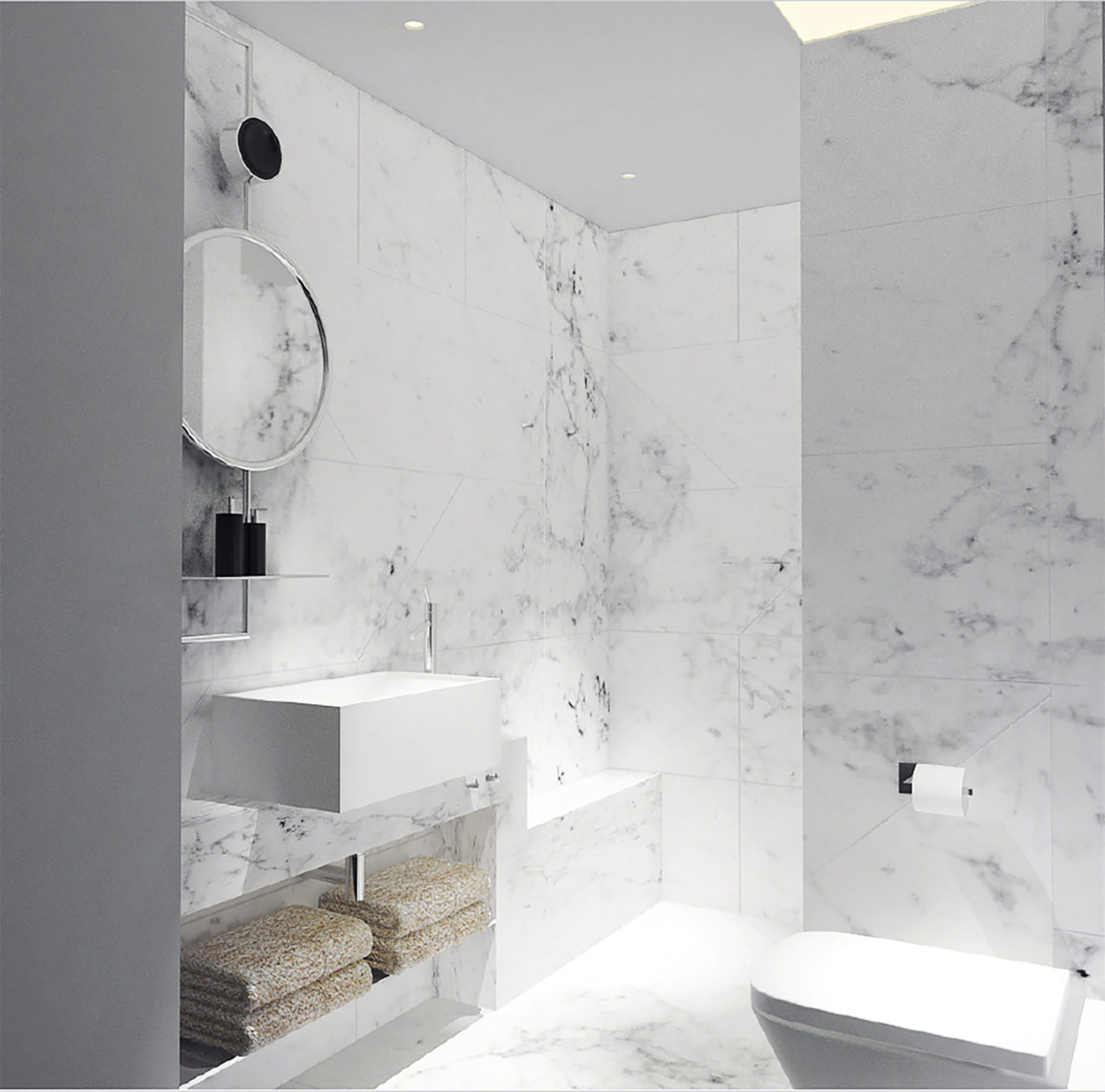 un bagno rivestito in marmo bianco