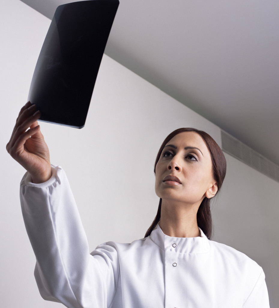 Dentist studying an x-ray cbct