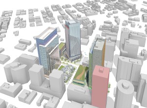 IL PROGETTO. L'intero intervento visto dall'alto: oltre alle tre torri da 38 piani è prevista la realizzazione di due edifici in linea e uno a piastra, per complessivi oltre 300.000 metri quadrati di superficie. Il Westin Building, che fornirà calore alla sede Amazon, è l'edificio di colore rosso, in basso a destra. (Foto NBBJ)