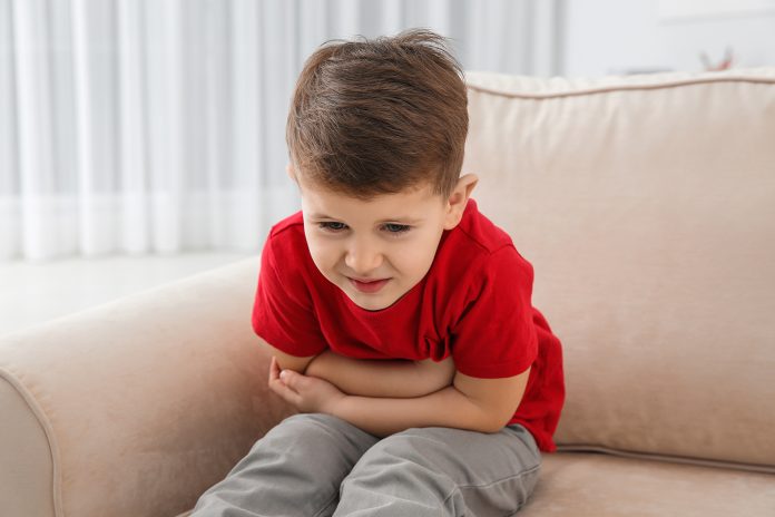 Little,Boy,Suffering,From,Nausea,In,Living,Room