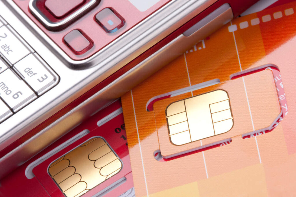 Close-up of mobile phone with sim cards - ph credits: AdobeStock