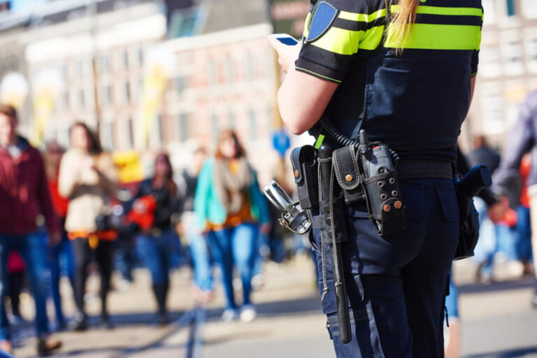 city safety and security. policeman watching order in the urban street - ph credits: AdobeStock