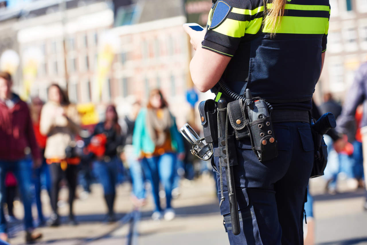 city safety and security. policeman watching order in the urban street - ph credits: AdobeStock