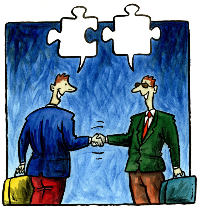 Two businessmen shaking hands and talking