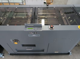 I sistemi di cucitura a punto metallico Duplo in linea alle stampanti Ricoh