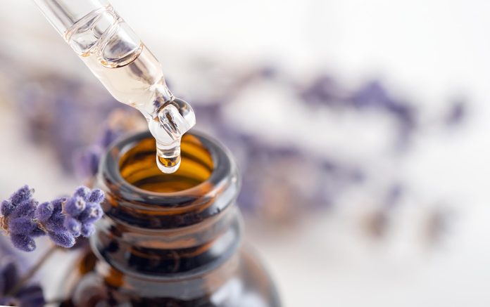 Essential,Oil,With,A,Dropper,Pipette,And,Lavender,Branches,On