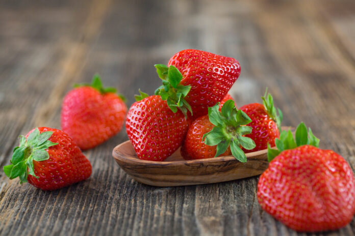 Strawberries,In,Wooden,Bowl.,Fresh,Nice,Strawberries,On,Wooden,Table.