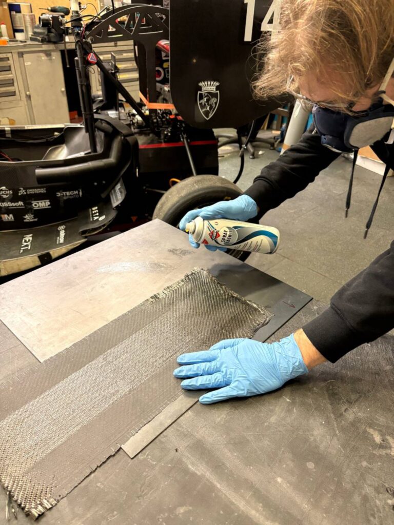 Jacopo Benfatto, Division Leader of the Chassis and Composites division, applies the spray tack