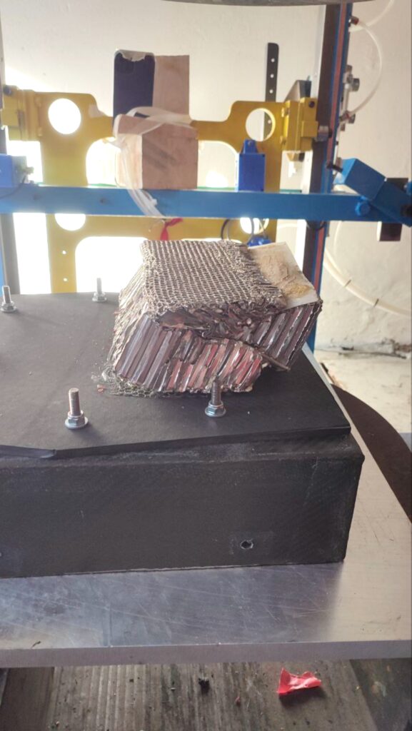 Impact test result: signs of glue stress can be seen after the impact of the guillotine both at the base and between the second and third layers (the top layer)