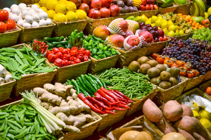 Fruit market with various colorful fresh fruits and vegetables consumi ortofrutta