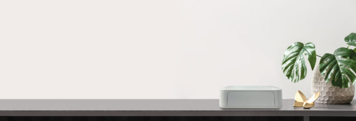Modern wi-fi router on dark table