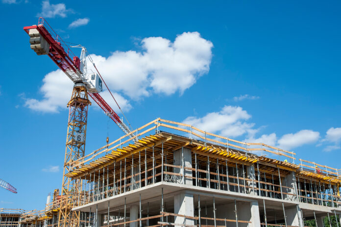 Apartment building under construction on a sunny day